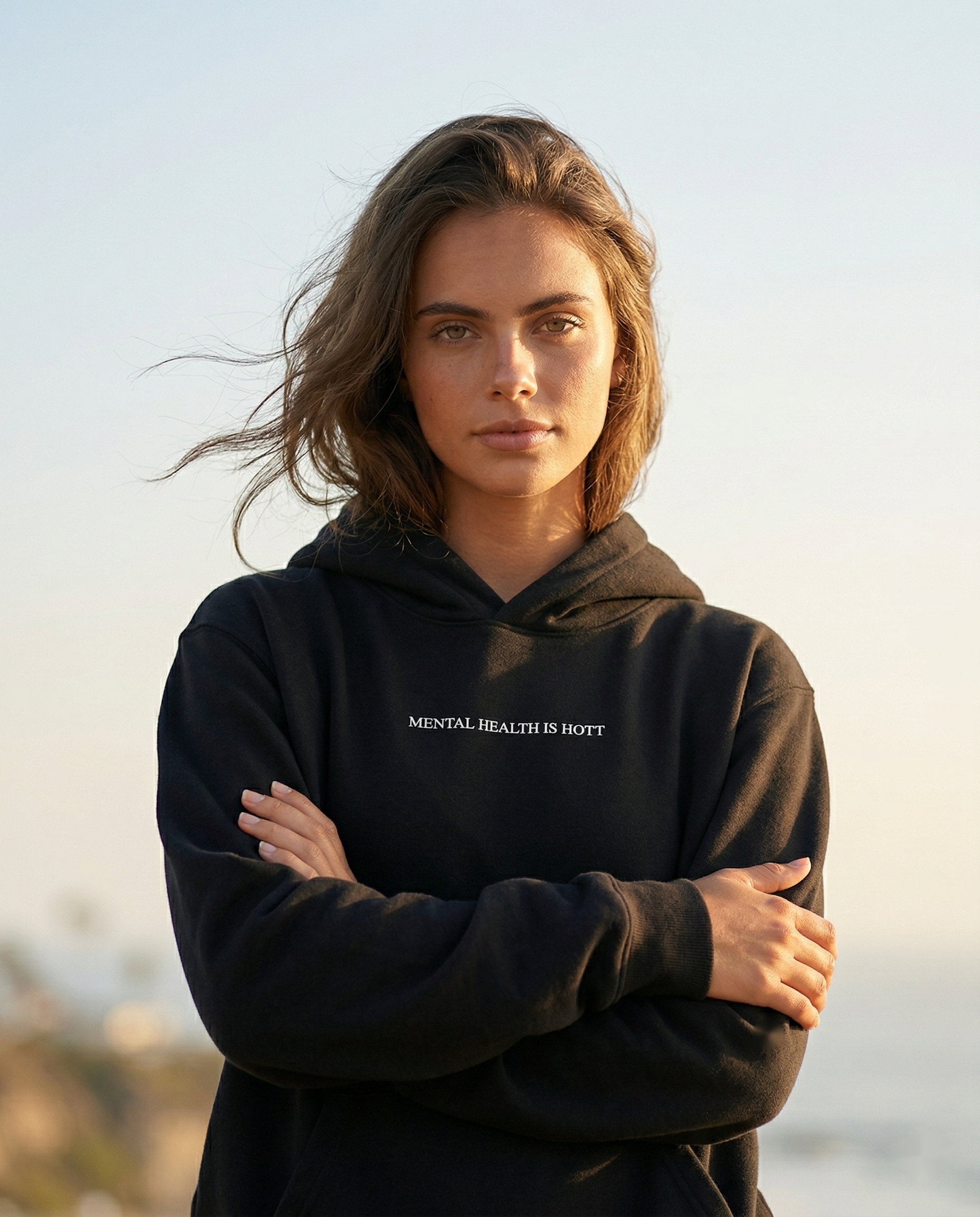 Woman wearing the black Mental Health Is Hott hoodie