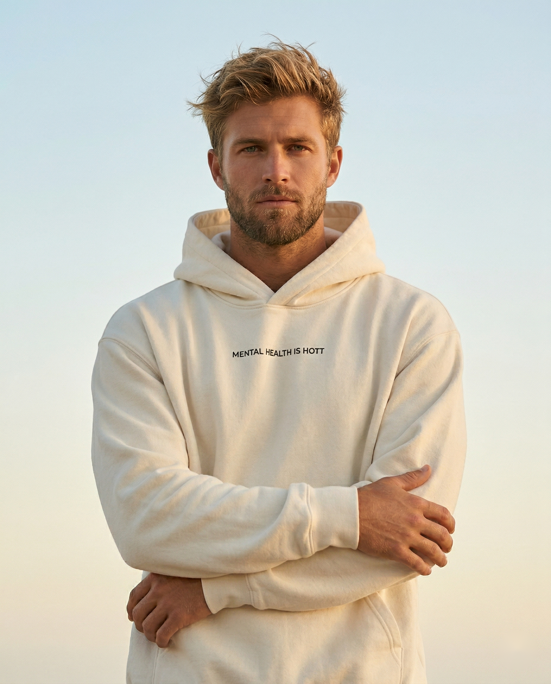 Man wearing the Ivory Room Mental Health Is Hott hoodie